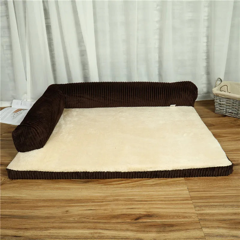 Grey corduroy dog sofa bed with bilateral bolsters on a wooden floor.