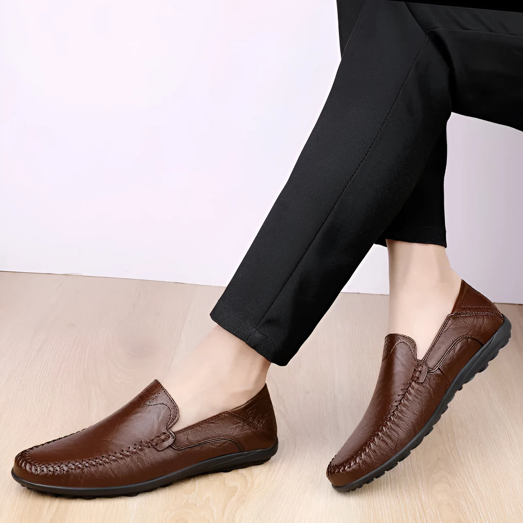 Men's brown leather casual shoes with round toe and flat rubber sole shown from side view