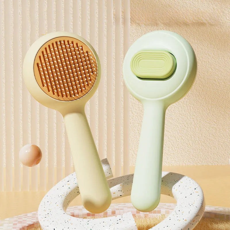 Green pet grooming brush with stainless steel teeth and non-slip handle for cats and dogs
