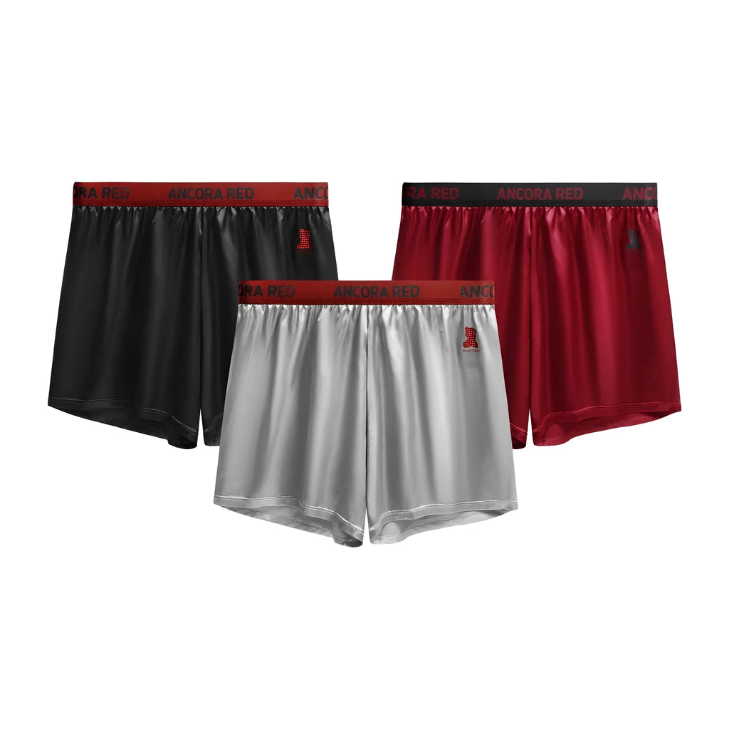 Solid colour men's polyester boxer briefs in black, shown with mid-waist design.