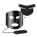 Black and white LED phototherapy face mask with controller for home skin treatment.