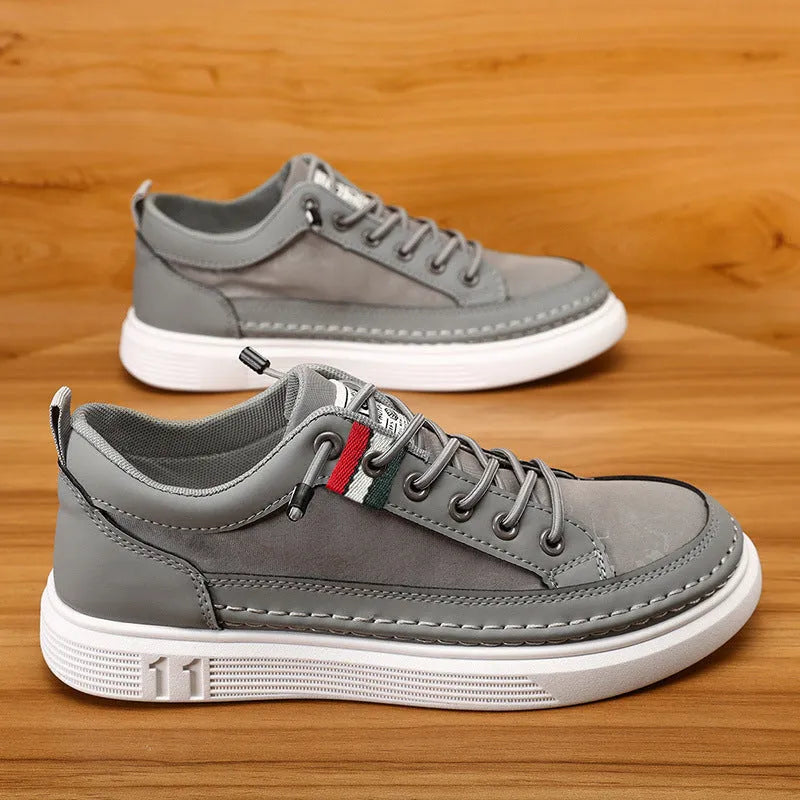 Men's grey high-top casual sneakers with round toe and PVC sole on a white background.