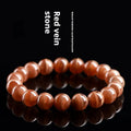 Natural Old Mine Rhodochrosite round bead bracelet from Peru showing pinkish-red mineral colour