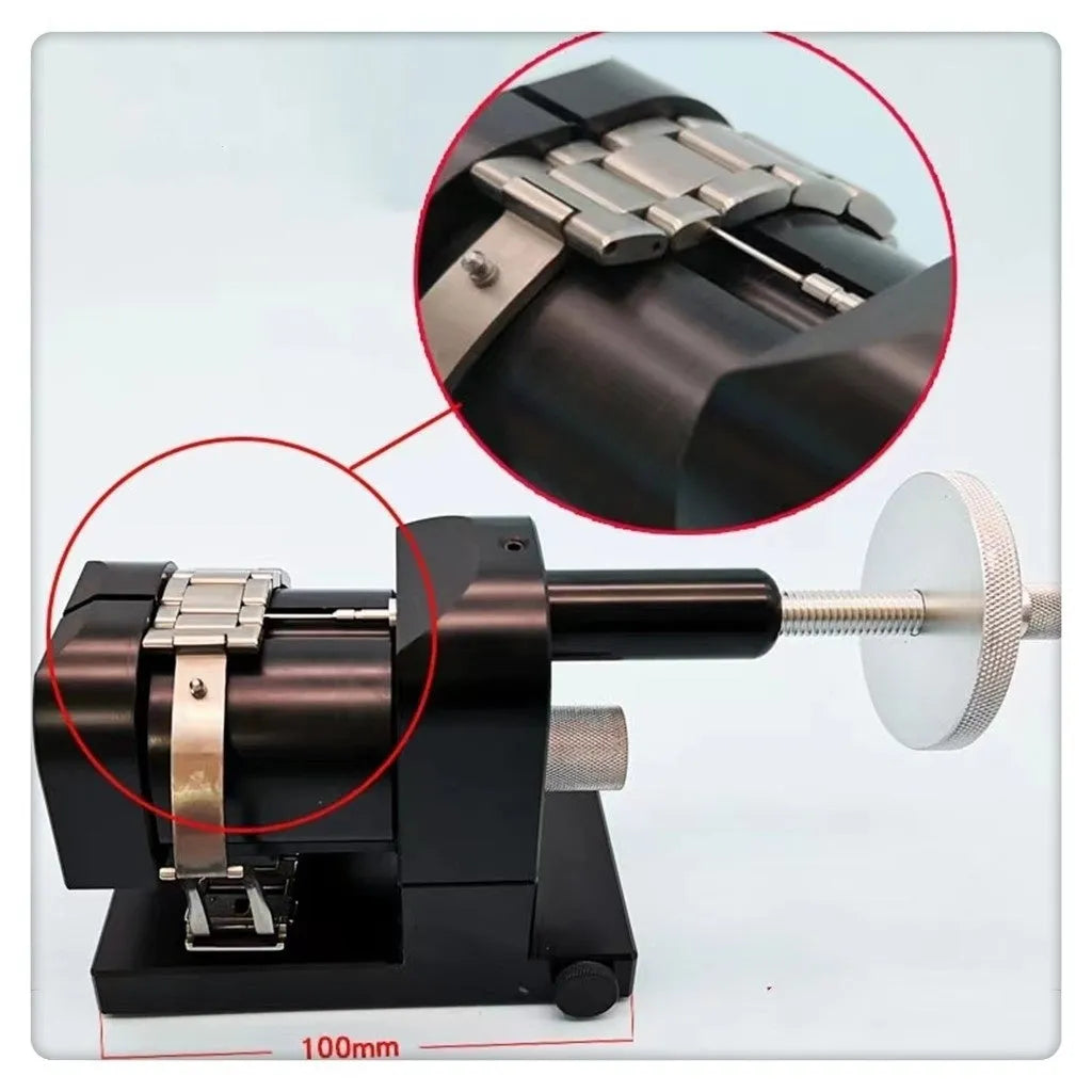 Steel alloy watch strap removal tool with spring mechanism on a work surface