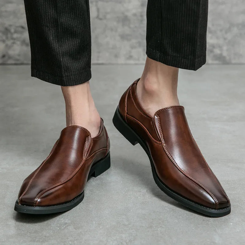 Men's black patent leather pointed toe casual shoes with a flat heel and totem design on a white background.