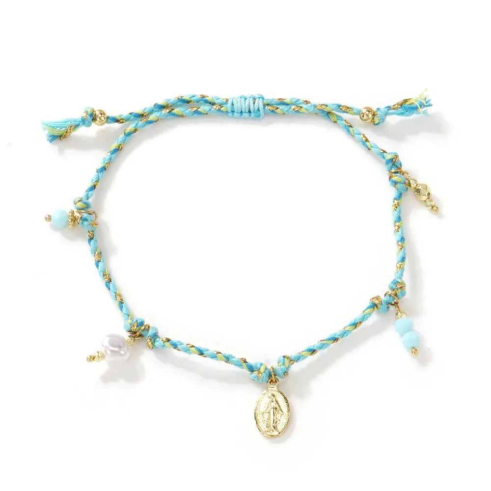Women's adjustable woven bracelet made from colourful braided rope with a strap tag.