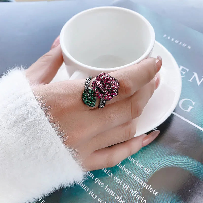 Geometric women's ring with red corundum stone and black gold finish