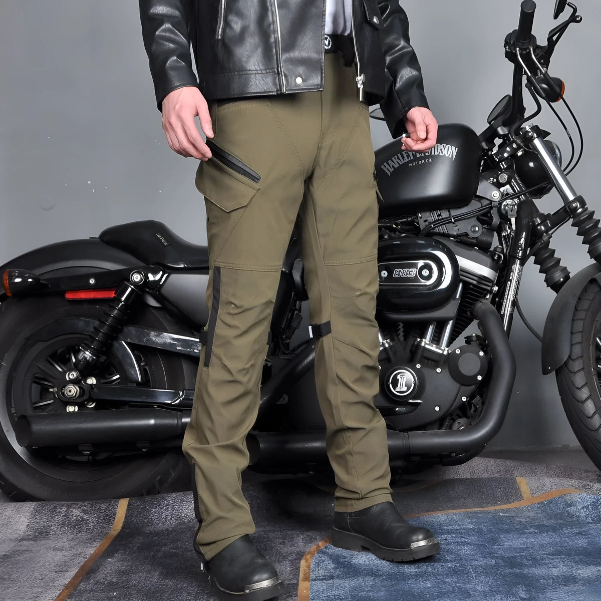 Men's waterproof motorcycle cycling trousers in black or green with included belt and protective gear.