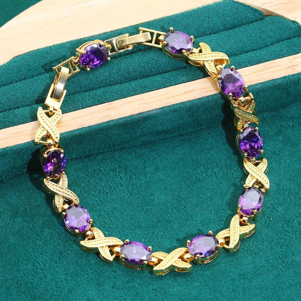 Gold plated jewellery set with multi-colour cubic zirconia stones, showing necklace, earrings, ring, and bracelet.