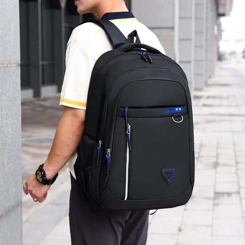 Men's Oxford cloth schoolbag in black with letter pattern detailing showing 20-35L capacity and burden reduction system