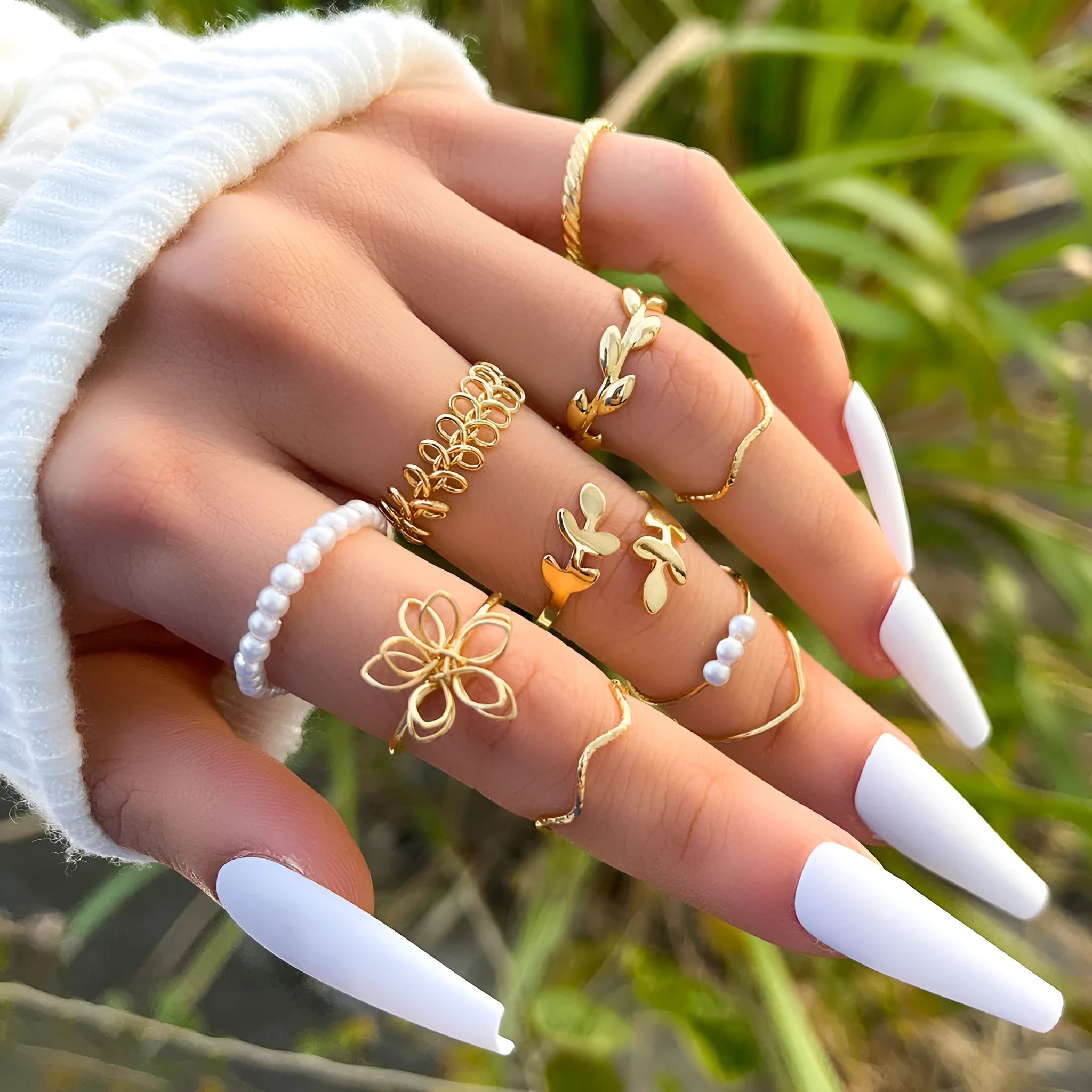 Gold coloured openwork flower shape alloy ring with a glossy electroplated finish.