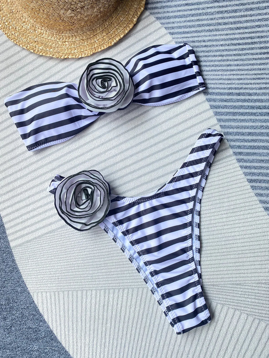 A striped women's cross-back bikini with a floral split design on the briefs.