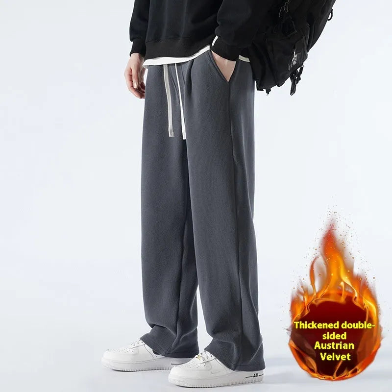 Men's apricot coloured loose-fit polar fleece winter trousers with a drawstring waist, shown flat.