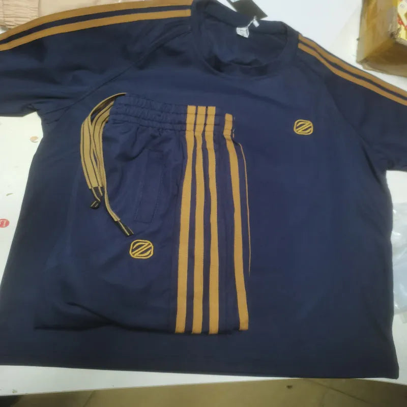 Men's blue short sleeve sports suit set with trousers, made from ironing-free Ice Silk polyester fabric.