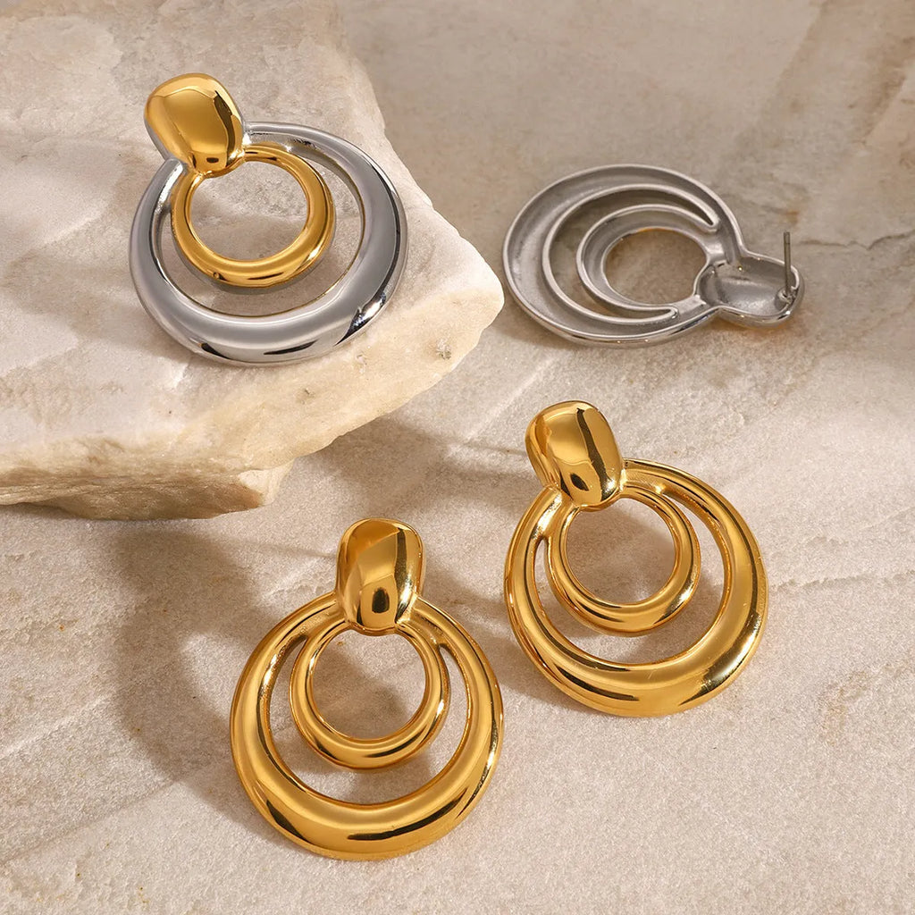 Gold plated double layer hollow stud earrings with round geometric design and titanium steel construction
