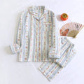 Women's red small fruit patterned cotton gauze long sleeve pyjama top and trousers set.