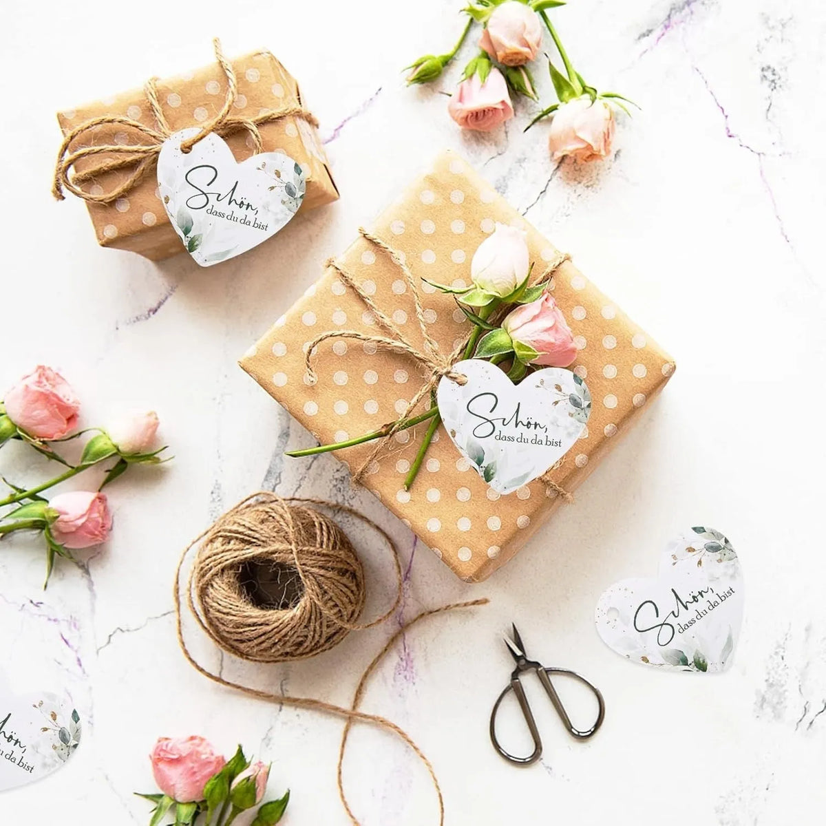 A set of 50 floral and heart-shaped paper gift tags in two colour styles.