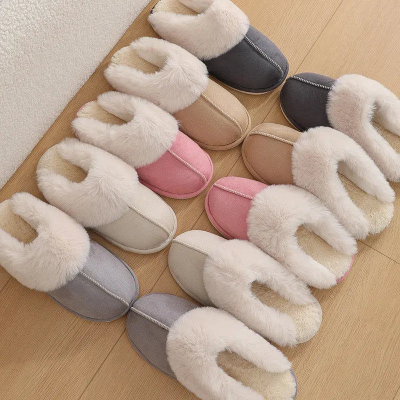 Women's plush-lined indoor slippers with round toe and flat heel in a choice of colours.