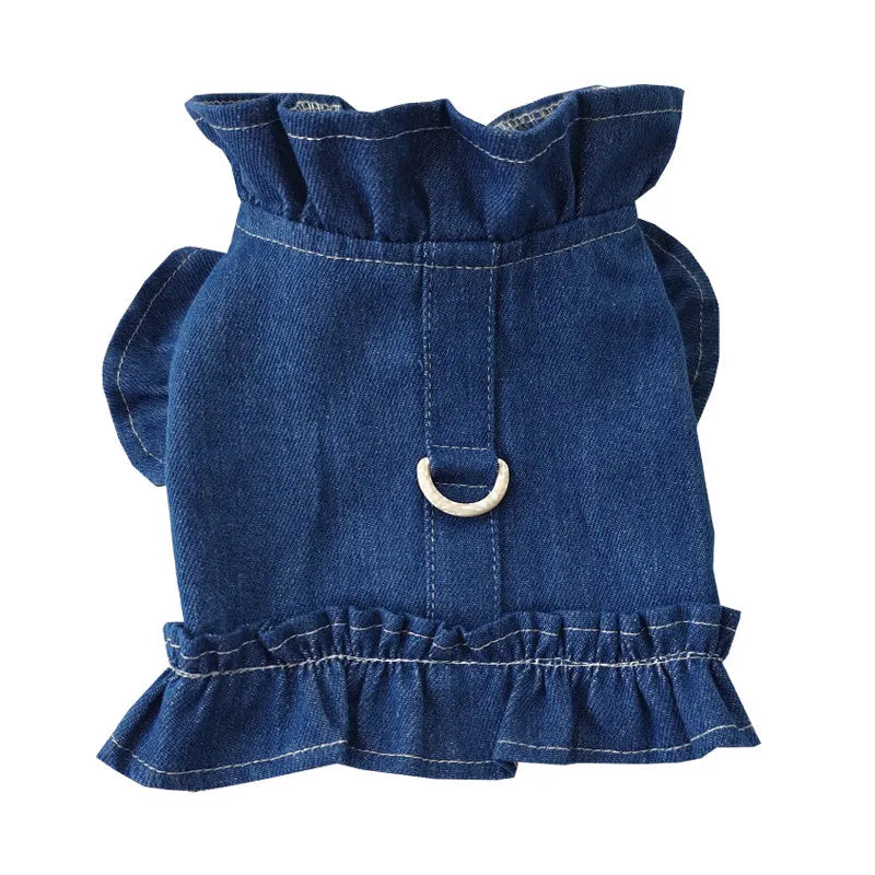 Blue denim pet dress with ruffles on the chest and a metal leash hook.