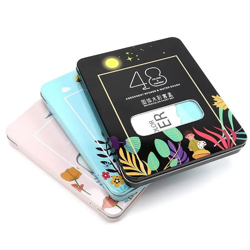 48 colour solid watercolour paint set showing Black Knight, Girl Pink and Sunshine Blue shades
