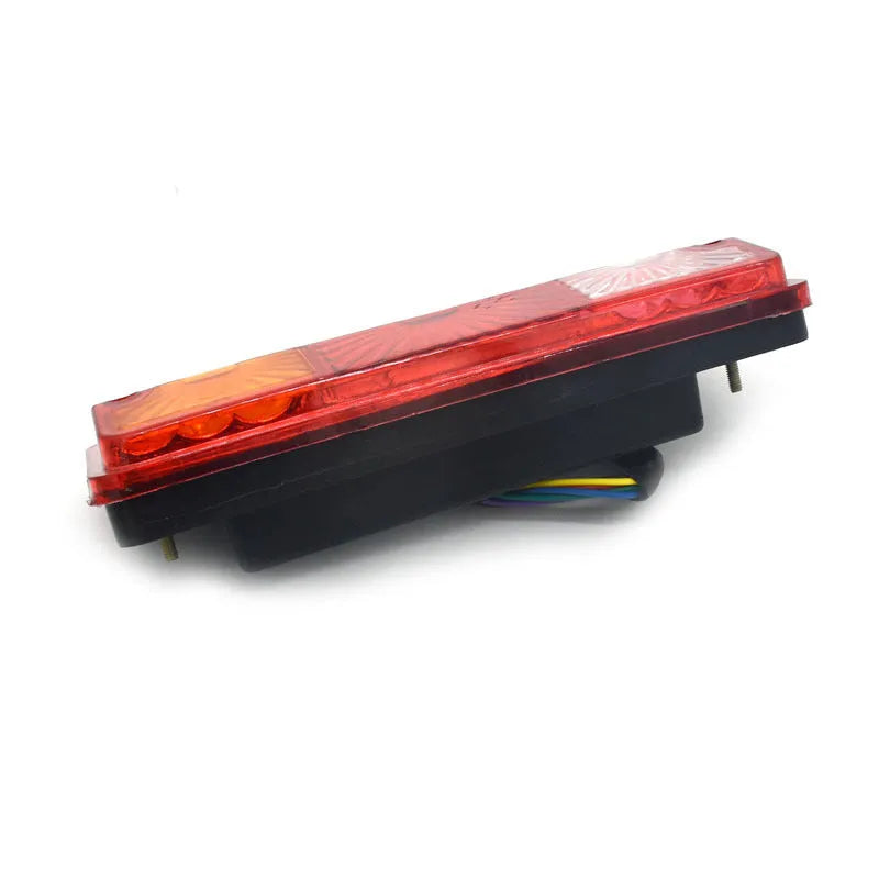 Black electric tricycle taillight with integrated shell design measuring 200mm by 70mm