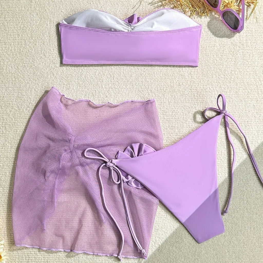 Women's tube top swimsuit with big flower tie, matching pants and skirt in blue