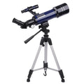 Dark blue children's monocular astronomical telescope with adjustable tripod set up for stargazing.