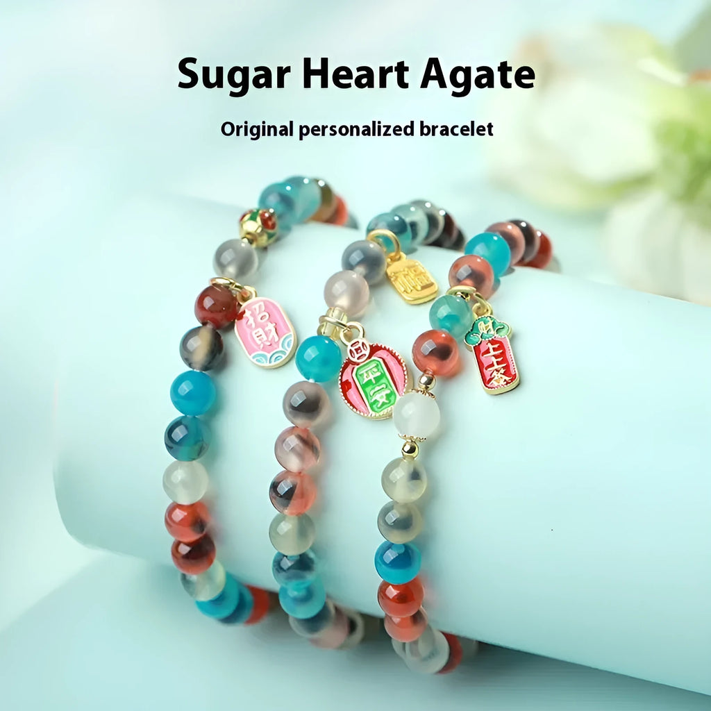 Women's agate snake bracelet with copper coin detailing and coloured glaze accents in geometric design