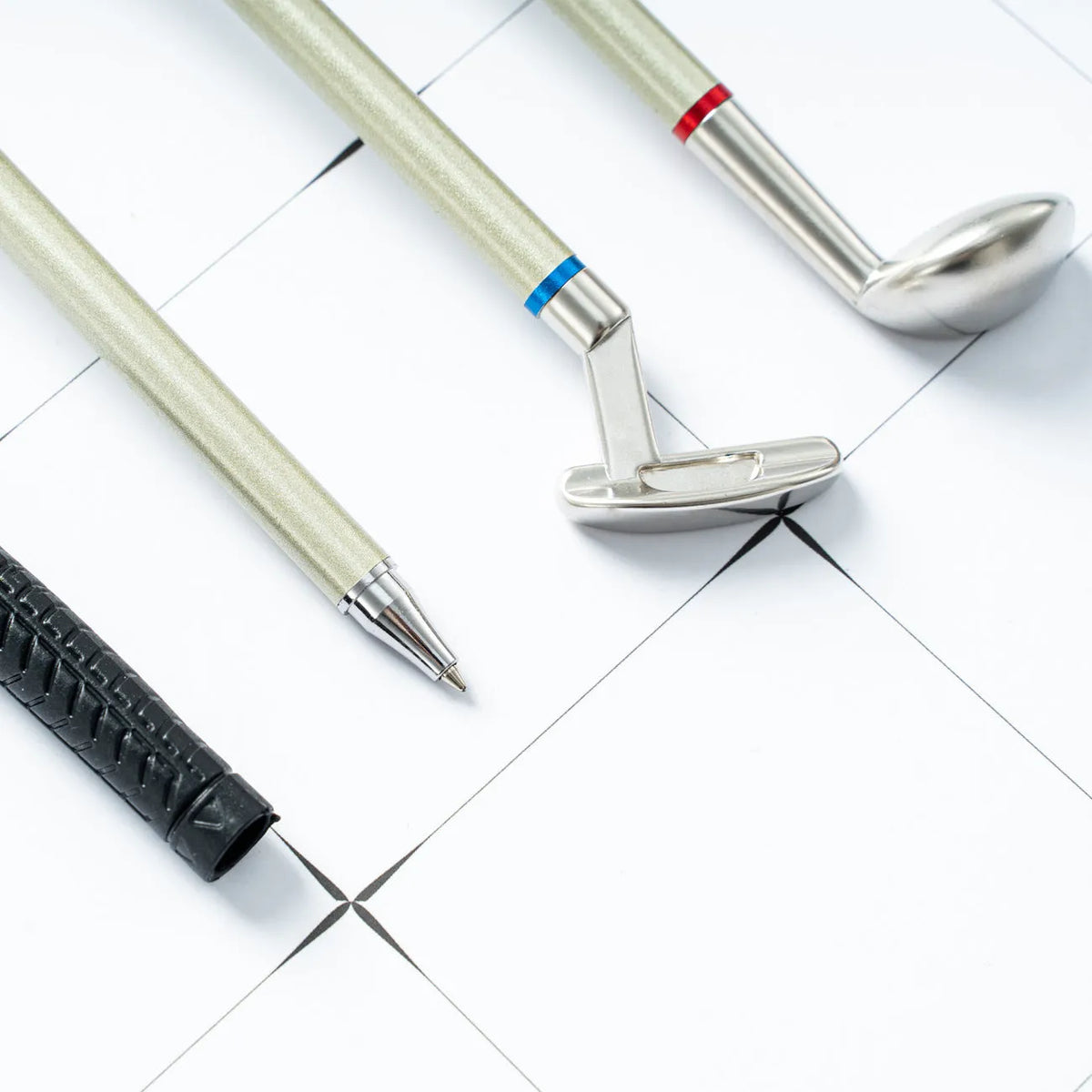 Three metal ballpoint pens with golf suit pattern design showing 0.7mm bullet-type pen heads