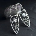 Silver lotus flower earrings with rhinestones on geometric alloy setting