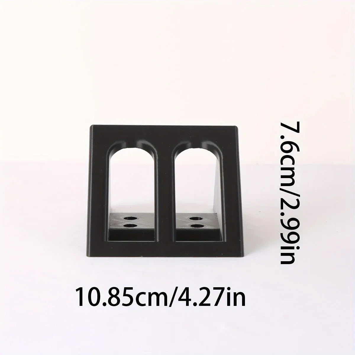 Black plastic pistol display stand with punk-style design measuring 10.85 by 7.6 centimetres
