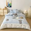 Cartoon Schnauzer design embroidered on a thickened cotton quilt cover and pillowcase from a complete bed linen set.