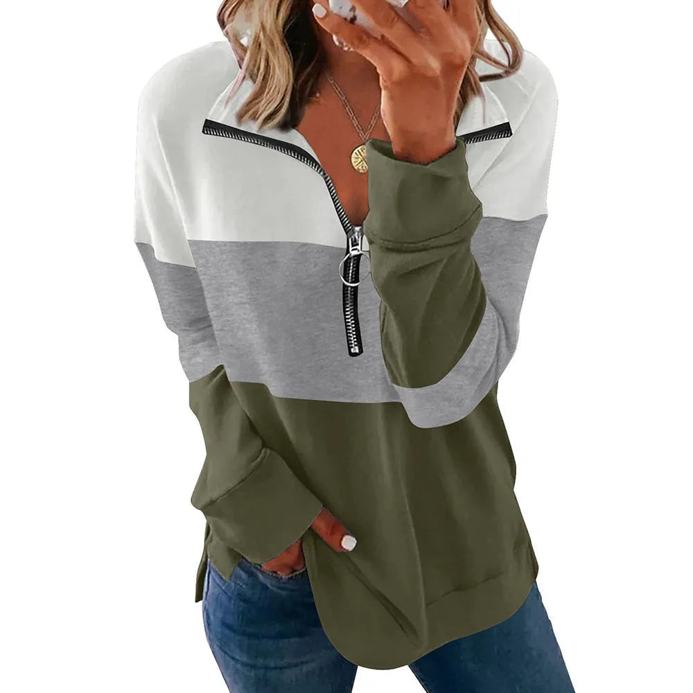 Women's loose long-sleeved leopard print sweater in polyester fabric on a hanger.