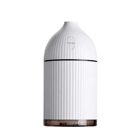 White ultrasonic aromatherapy diffuser humidifier with USB cable and LED light on wooden table
