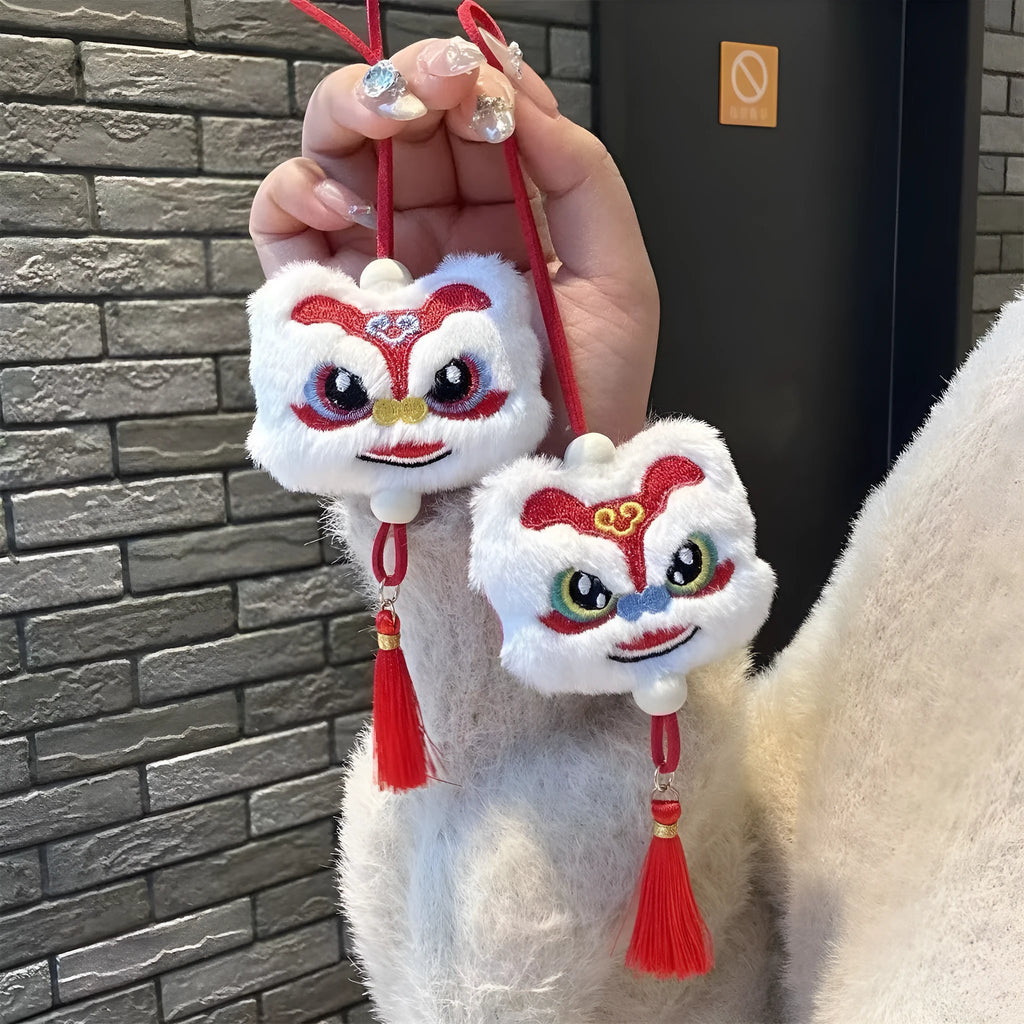 Blue and yellow handmade plush cartoon lion keychain with long tassel and star stone decoration.