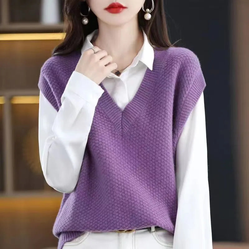 Women's cream V-neck sleeveless knit vest with a raised 3D pattern, laid flat.