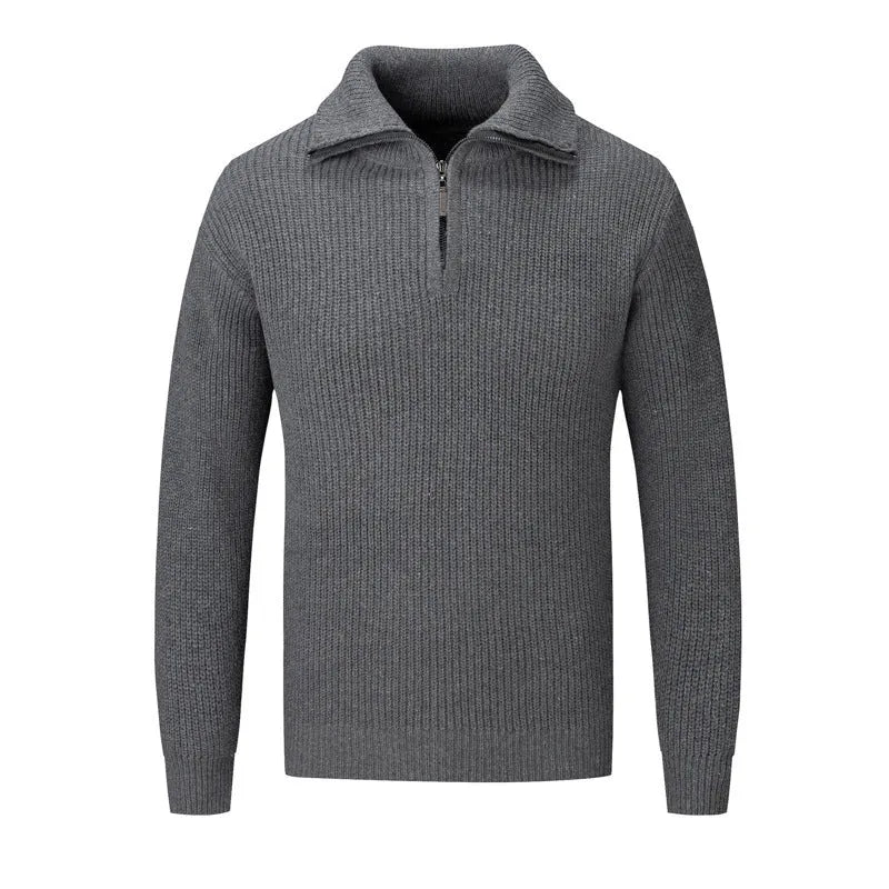 A man's loose-fitting slim pullover jumper in a solid colour, shown in a casual setting.