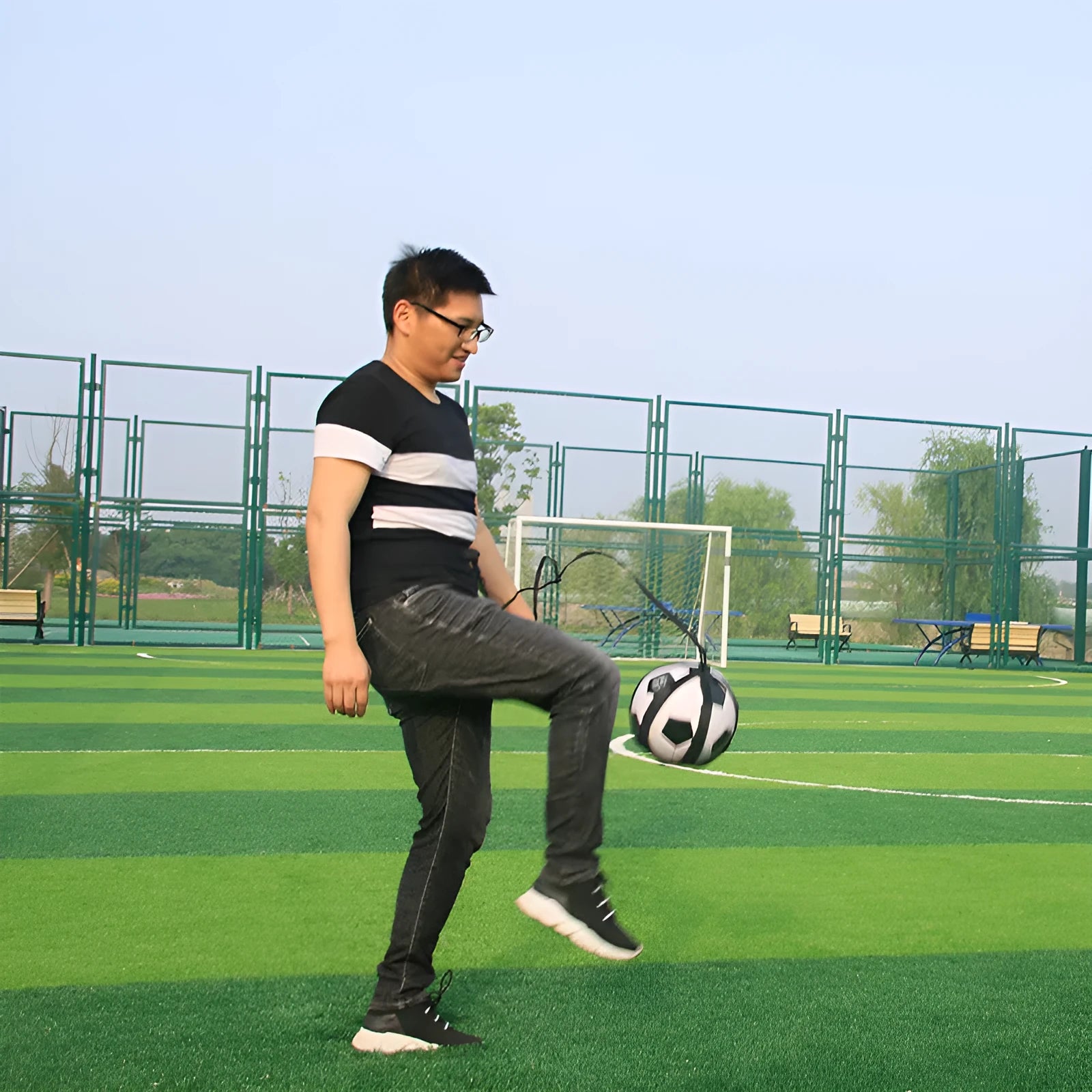 Black football juggling belt with a 2-metre cord for solo training drills.