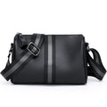 Black genuine leather one-shoulder crossbody bag showing front view and adjustable strap.
