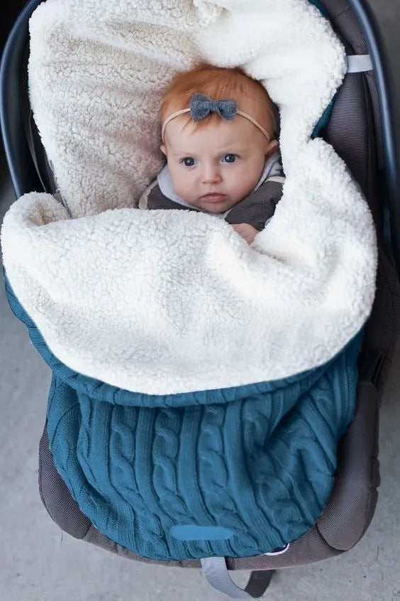 Envelope-style baby stroller sleeping bag in beige colour showing thick cotton wool filling and soft lining.