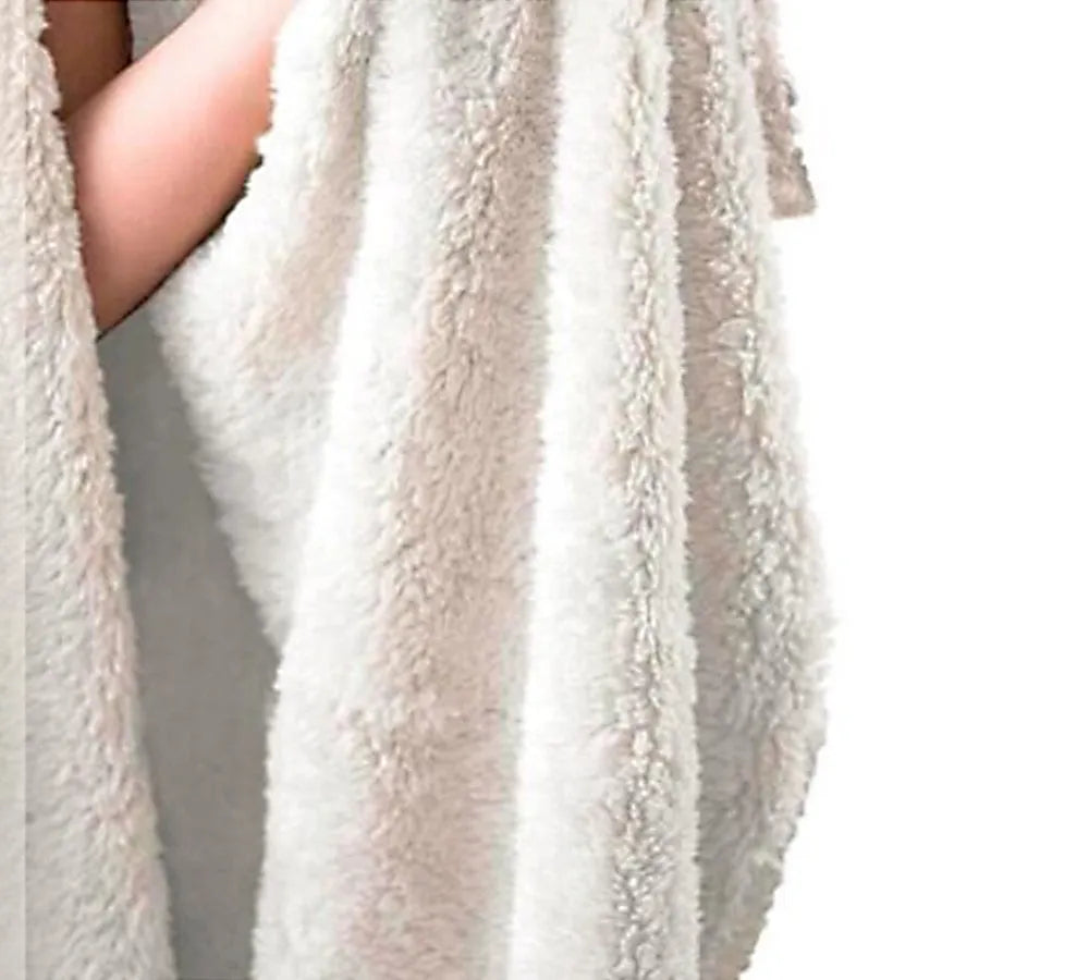 Round coral-coloured flannel burrito blanket with a delicious food print, folded to show soft texture.