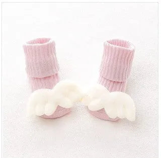 Cotton baby floor socks in a selection of colours and patterns like panda, lion, and bows, shown in sizes for infants.