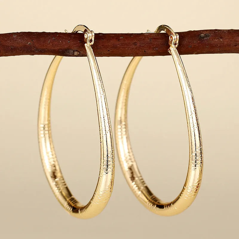 Women's geometric ring and line design ear clip earrings in electroplated copper