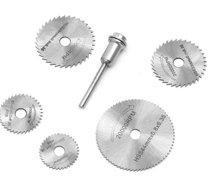 Six circular saw blades with mandrel on white background, high-speed steel construction