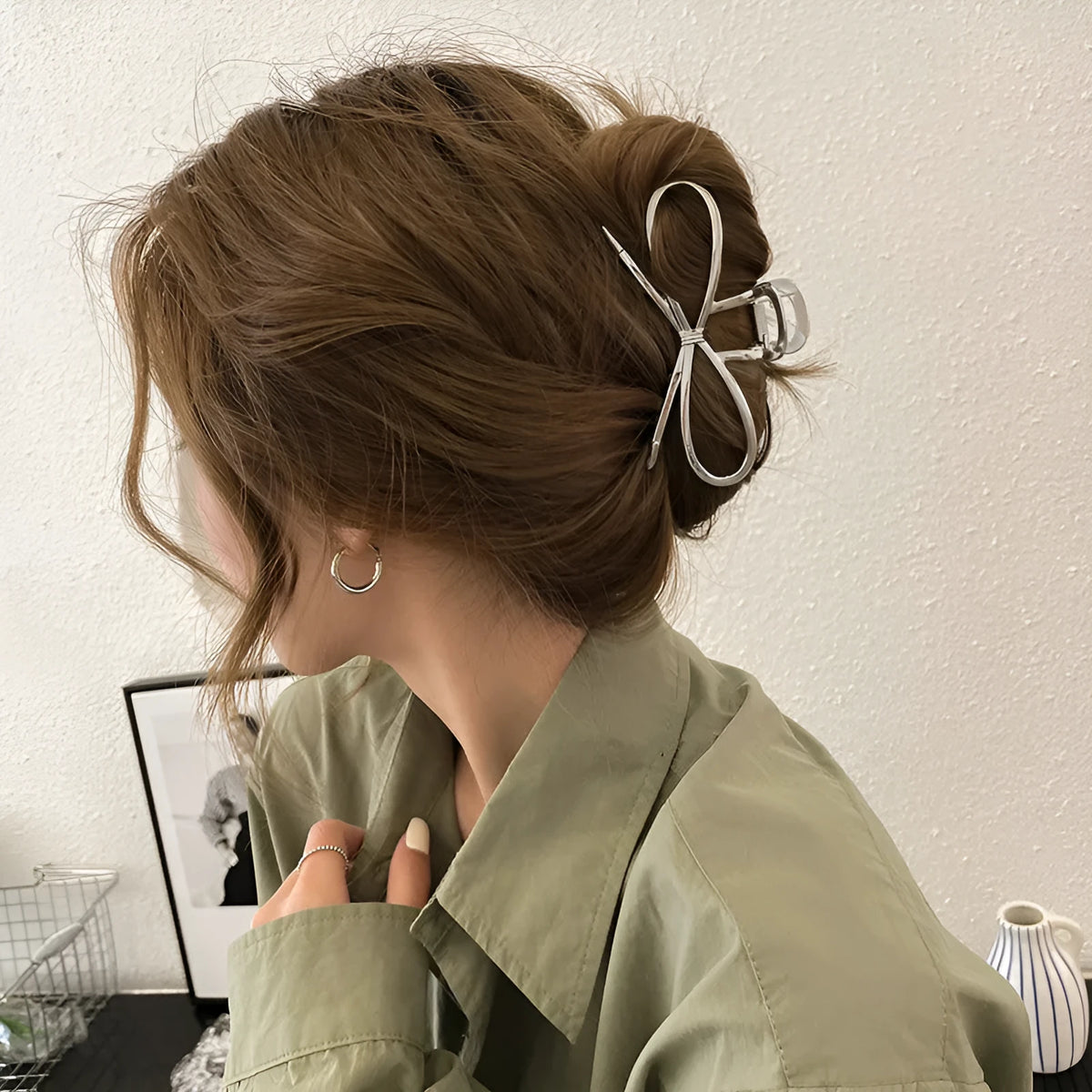 Gold and silver alloy hair barrettes with a bow design for women.