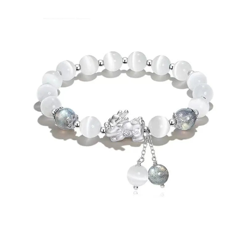 Natural black agate wave-shaped couple bracelet with money painting design on gray background