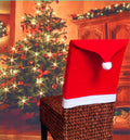Set of red and white Christmas dining chair covers featuring Santa Claus, Snowman, and Santa hat designs.