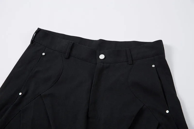 Men's black pleated machete casual trousers with loose-fitting wide-leg design and cotton construction