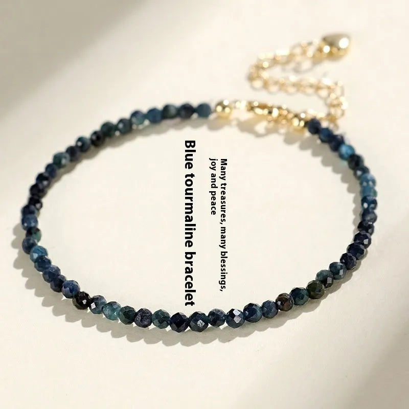 3mm blue tourmaline spacer bead bracelet showing alternating gemstone beads and metal elements