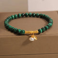 Women's adjustable bamboo bracelet with white crystal elements on a wrist.